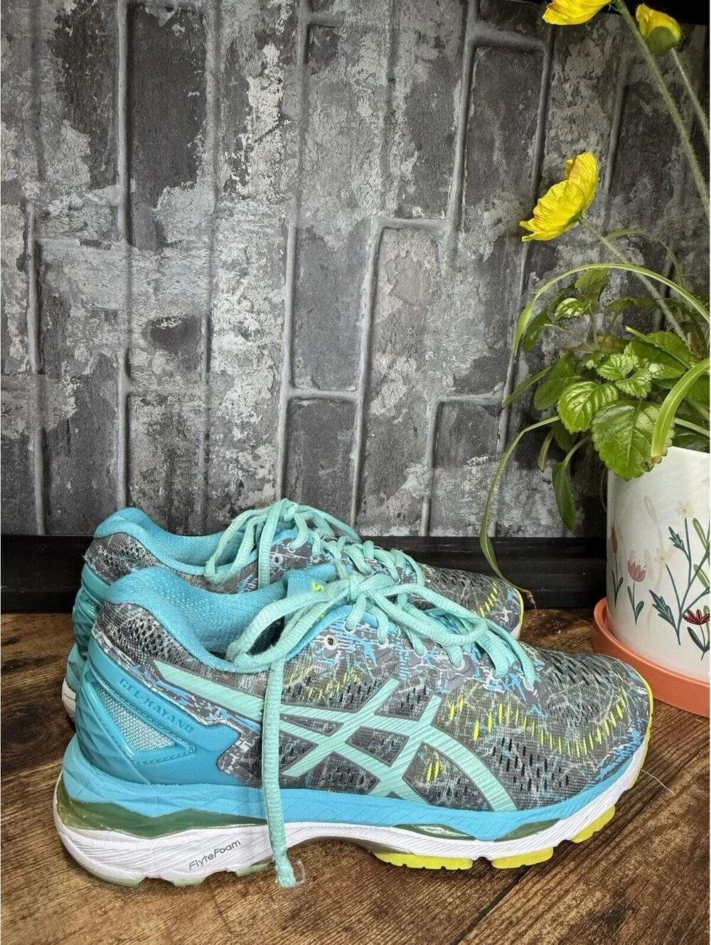 ASICS Gel-Kayano running shoes in a gray/blue/turquoise colorway, Women’s US 7.5
